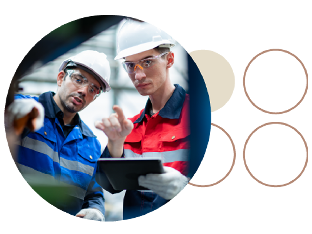Two engineers inspecting machinery