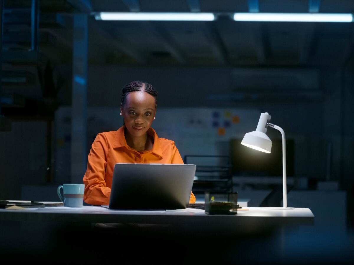 Person looking at a laptop computer.