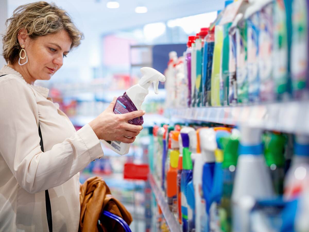 Person shopping for cleaning products.