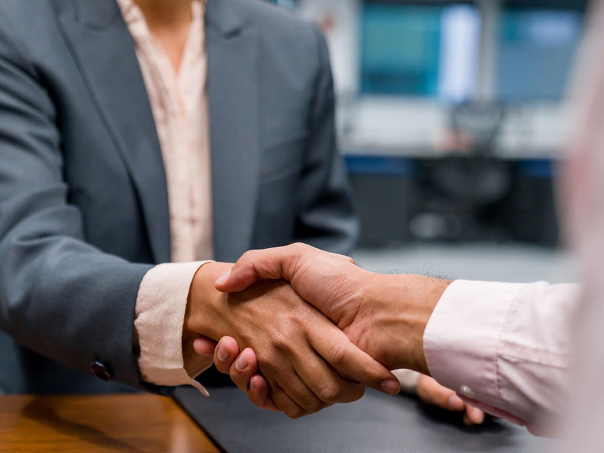 Two people shaking hands