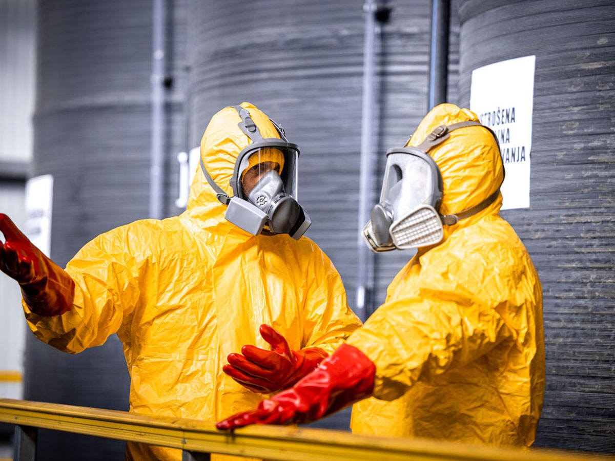 Two workers in hazmat suits