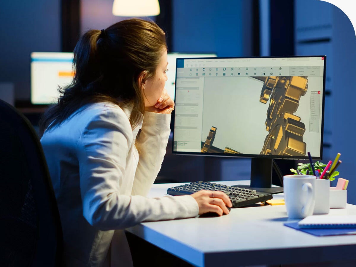 Industrial engineer studying prototype idea on pc showing cad software on device display