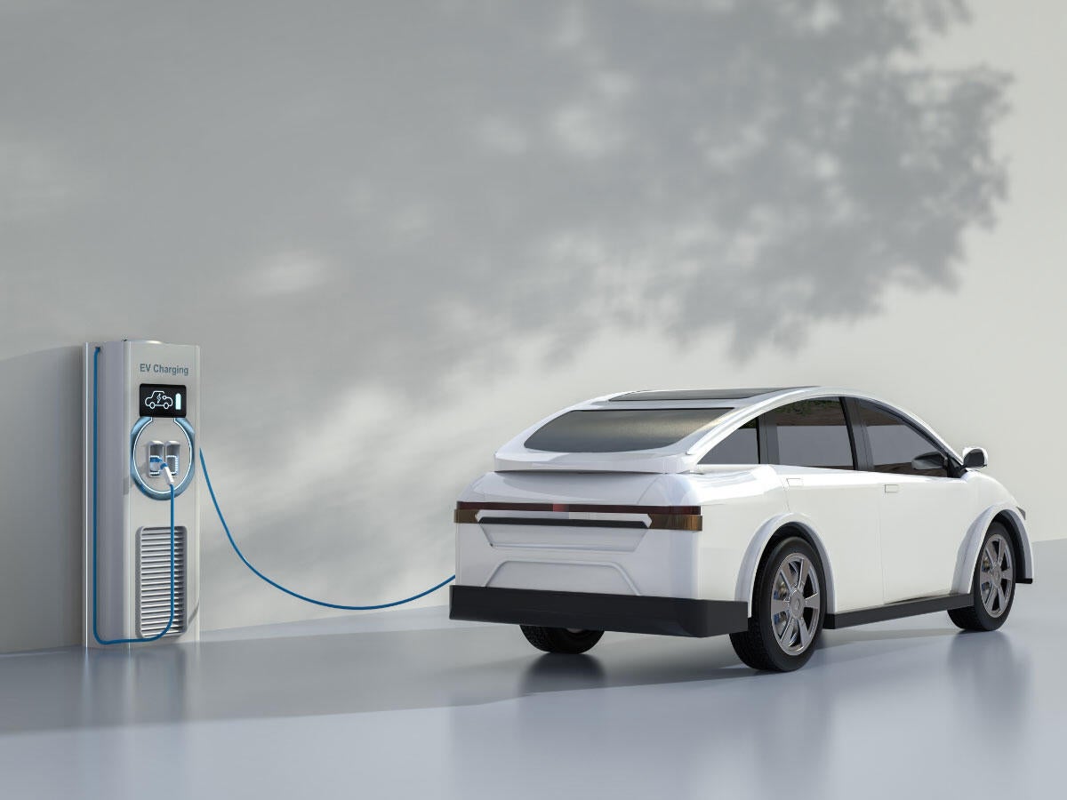 An electric vehicle charging at a port