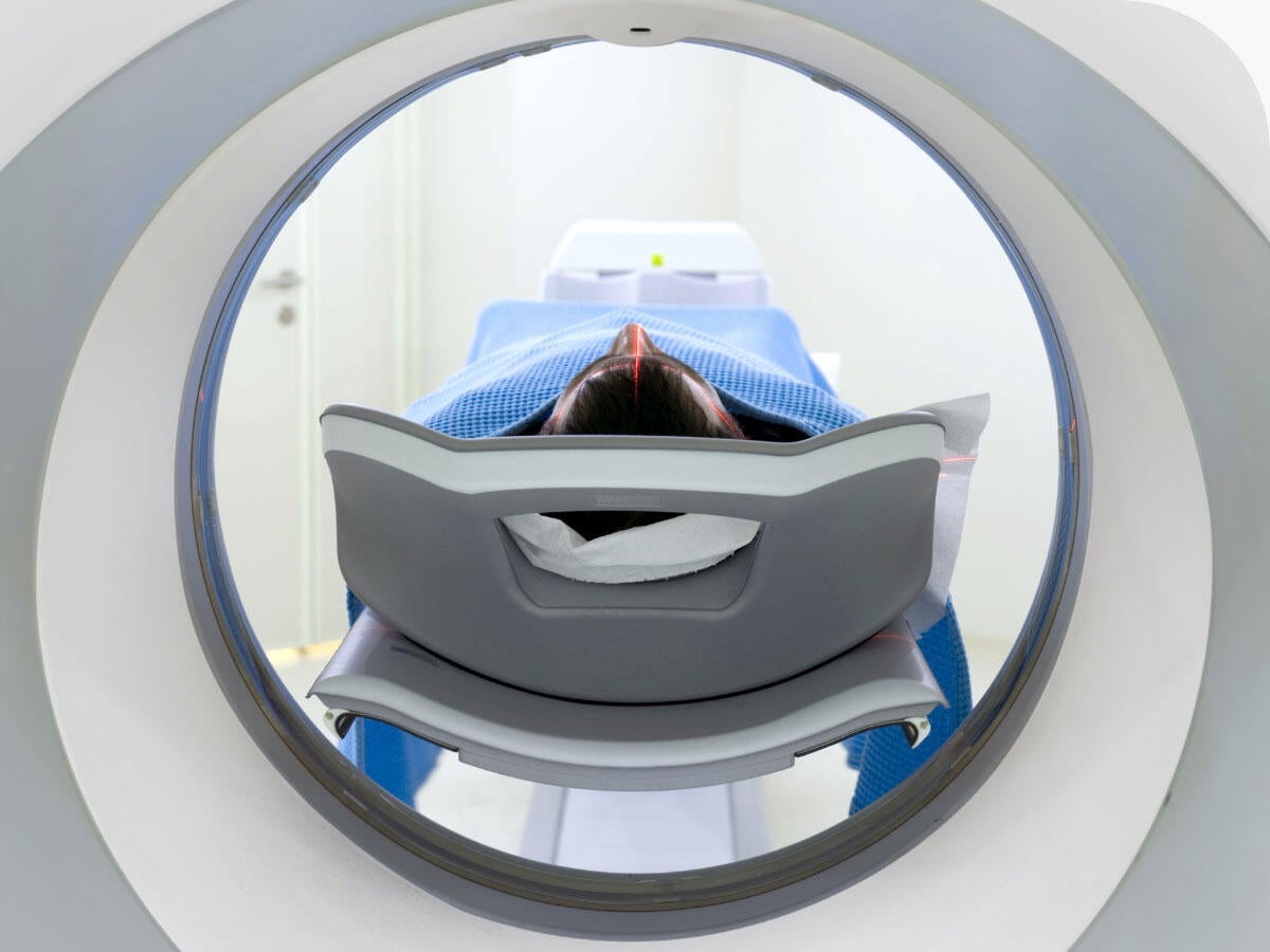 Rear view of a patient receiving an MRI