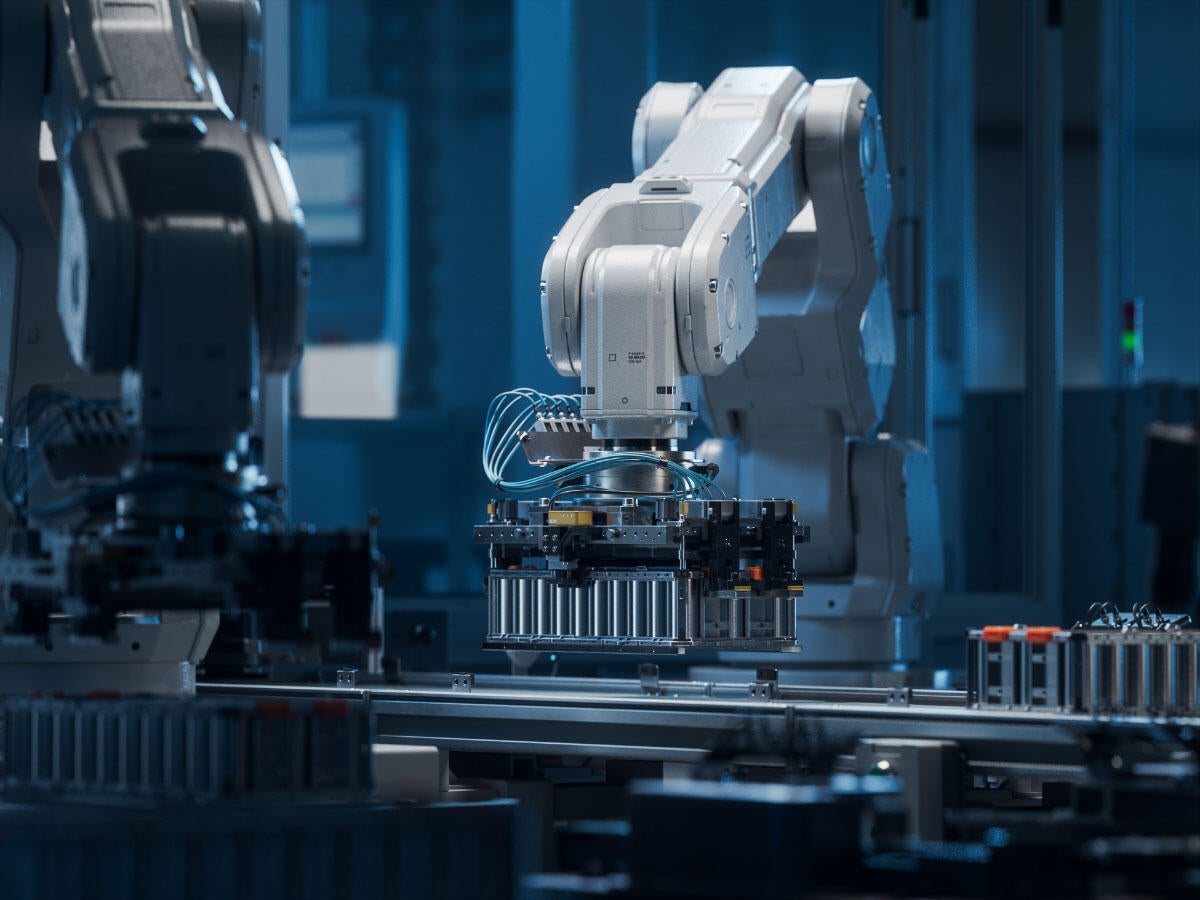 A robotic arm working on a battery