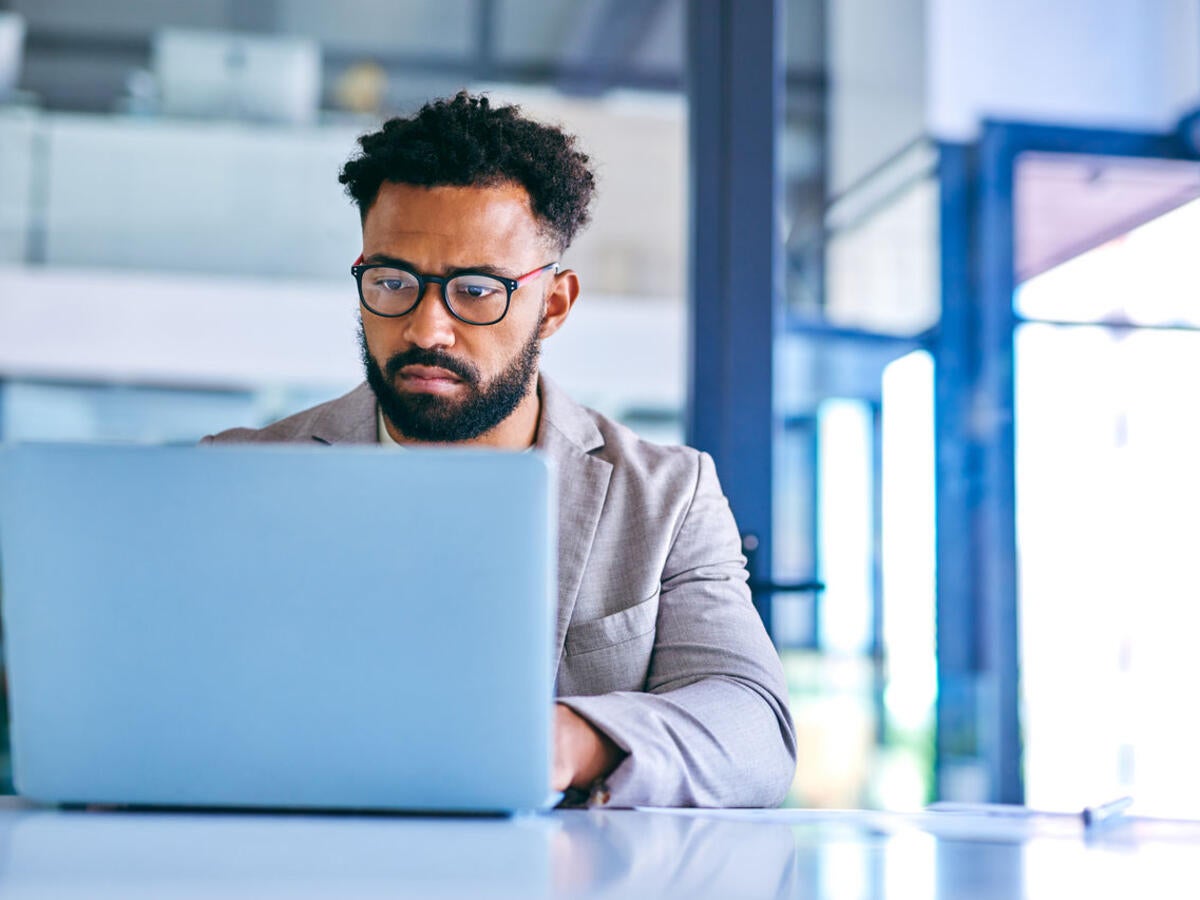 Person looking at laptop computer.