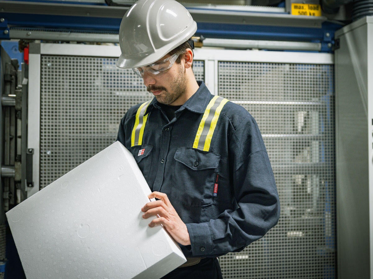 Engineer holding a block of polystyrene