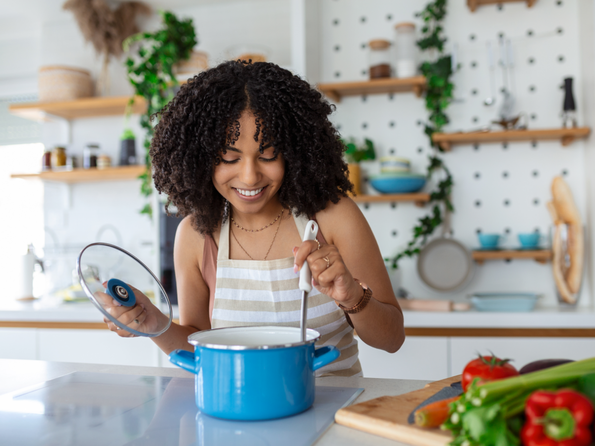 woman cooking soup