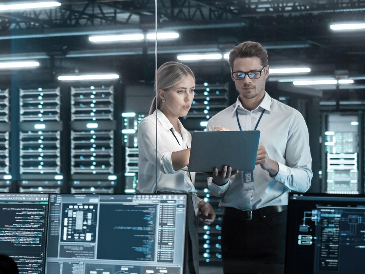 man and woman in data center