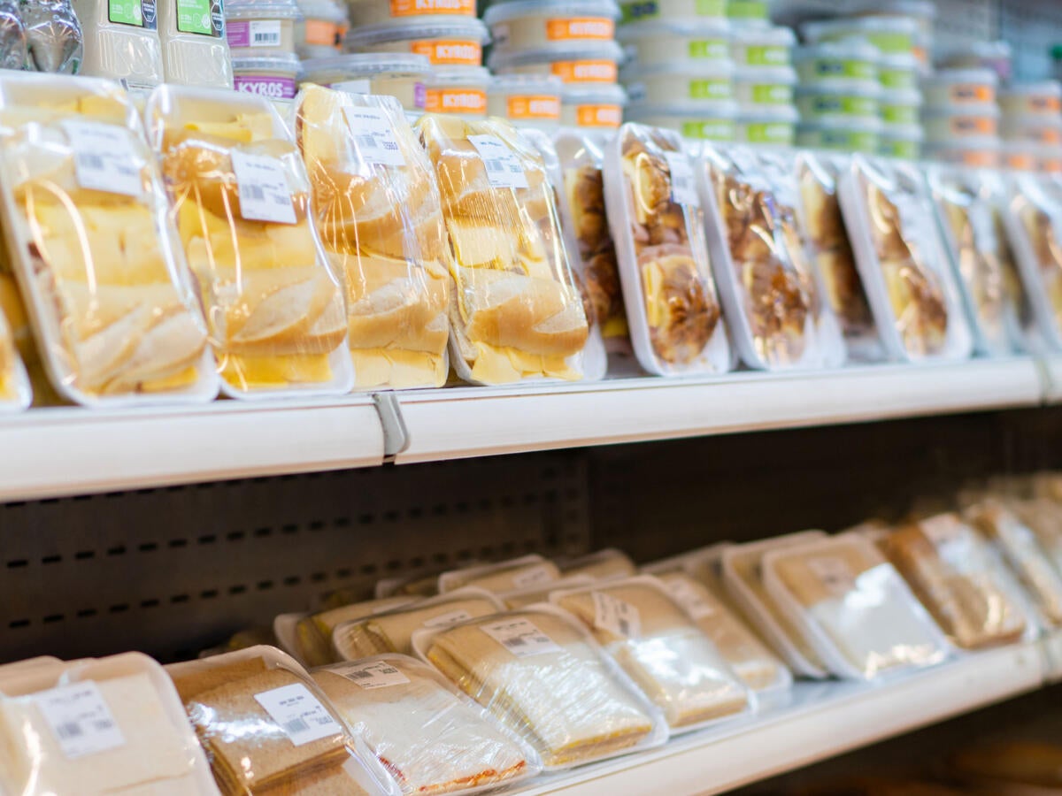 Prepackaged food on refrigerated grocery shelves