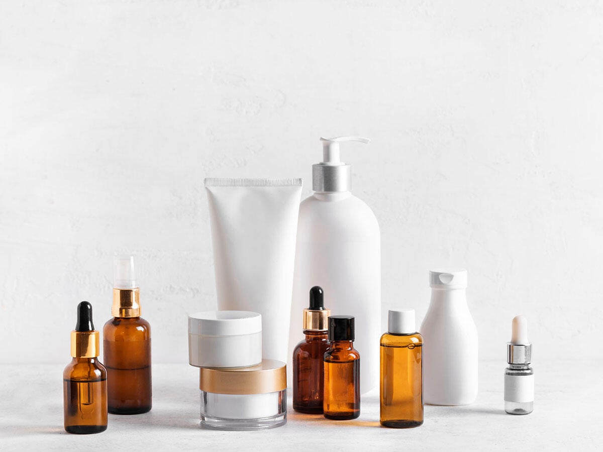 Several bottles and tubes of skincare products