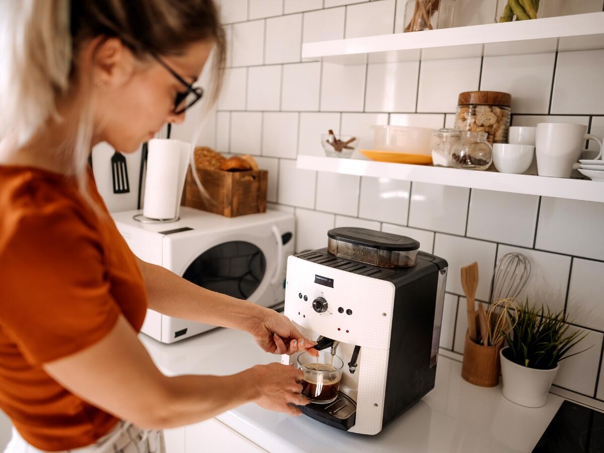 A person using a coffee maker