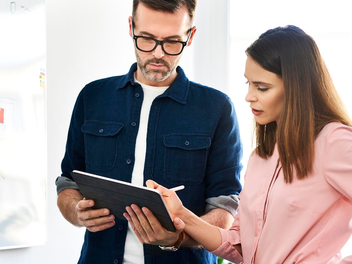 Two people working on a table