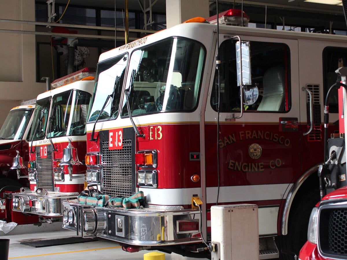 Line of fire trucks in a fire station
