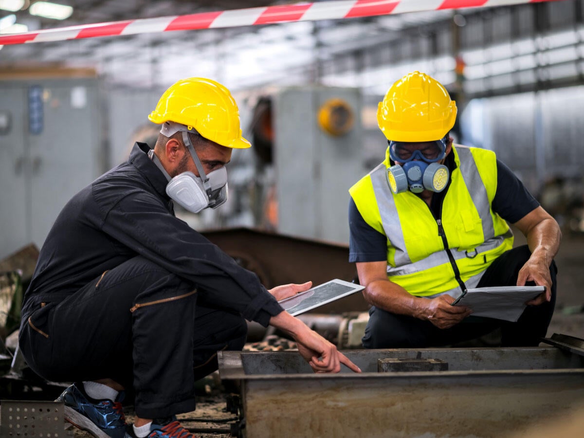 Two engineers inspecting electrical equipment