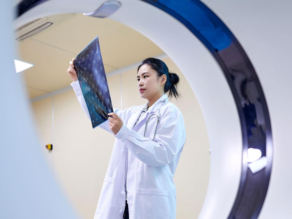 A doctor checking and MRI film