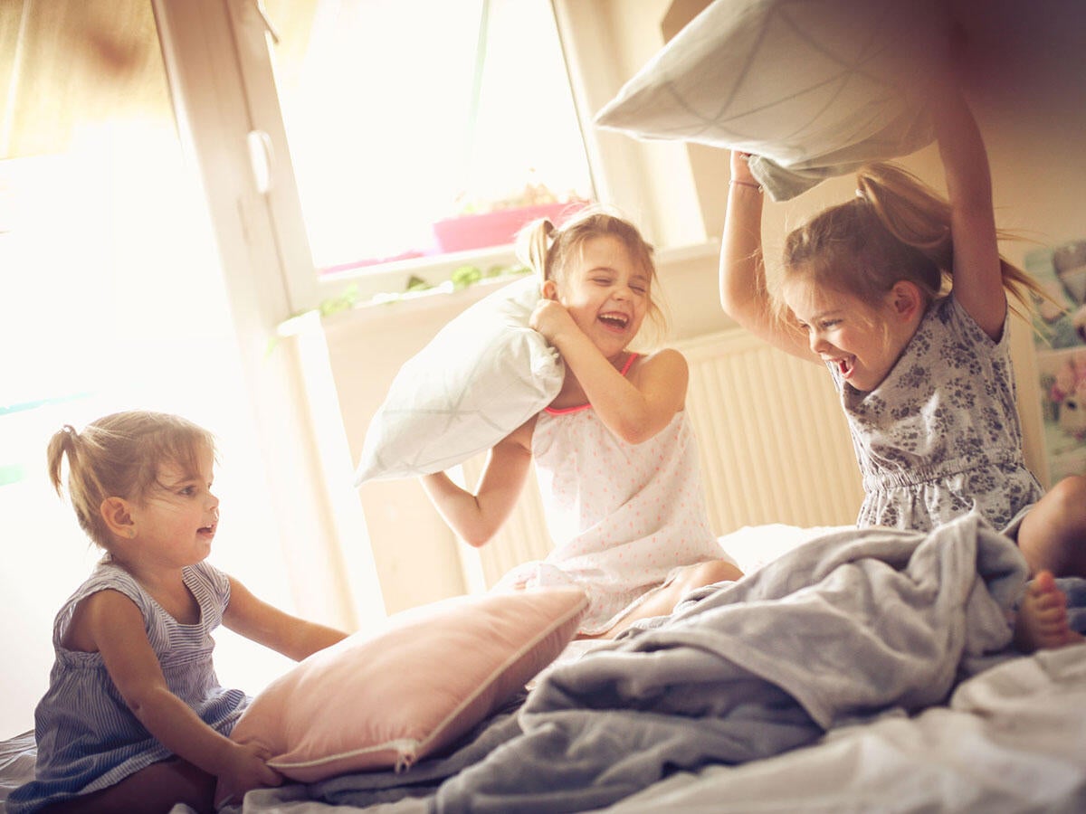 Kids having a pillow fight