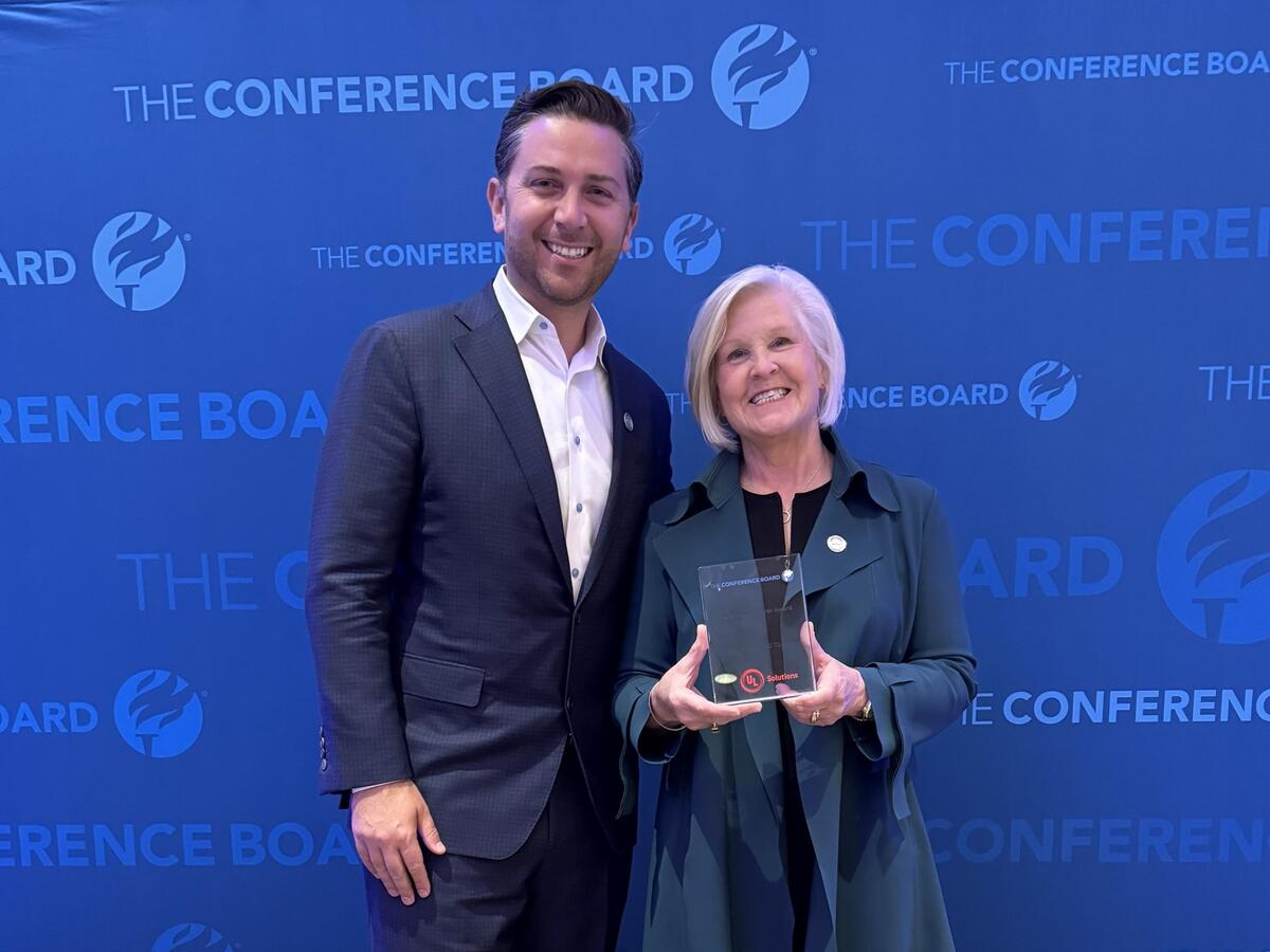 Alex Dadakis, executive vice president and president of Testing, Inspection and Certification at UL Solutions, and Linda Chapin, executive vice president and chief human resources officer, pose with the People First Excellence Award, presented by The Conference Board on June 3 in Chicago.