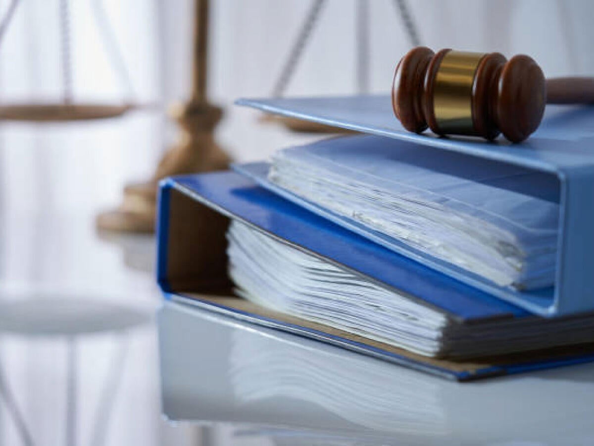 A gavel on a stack of books