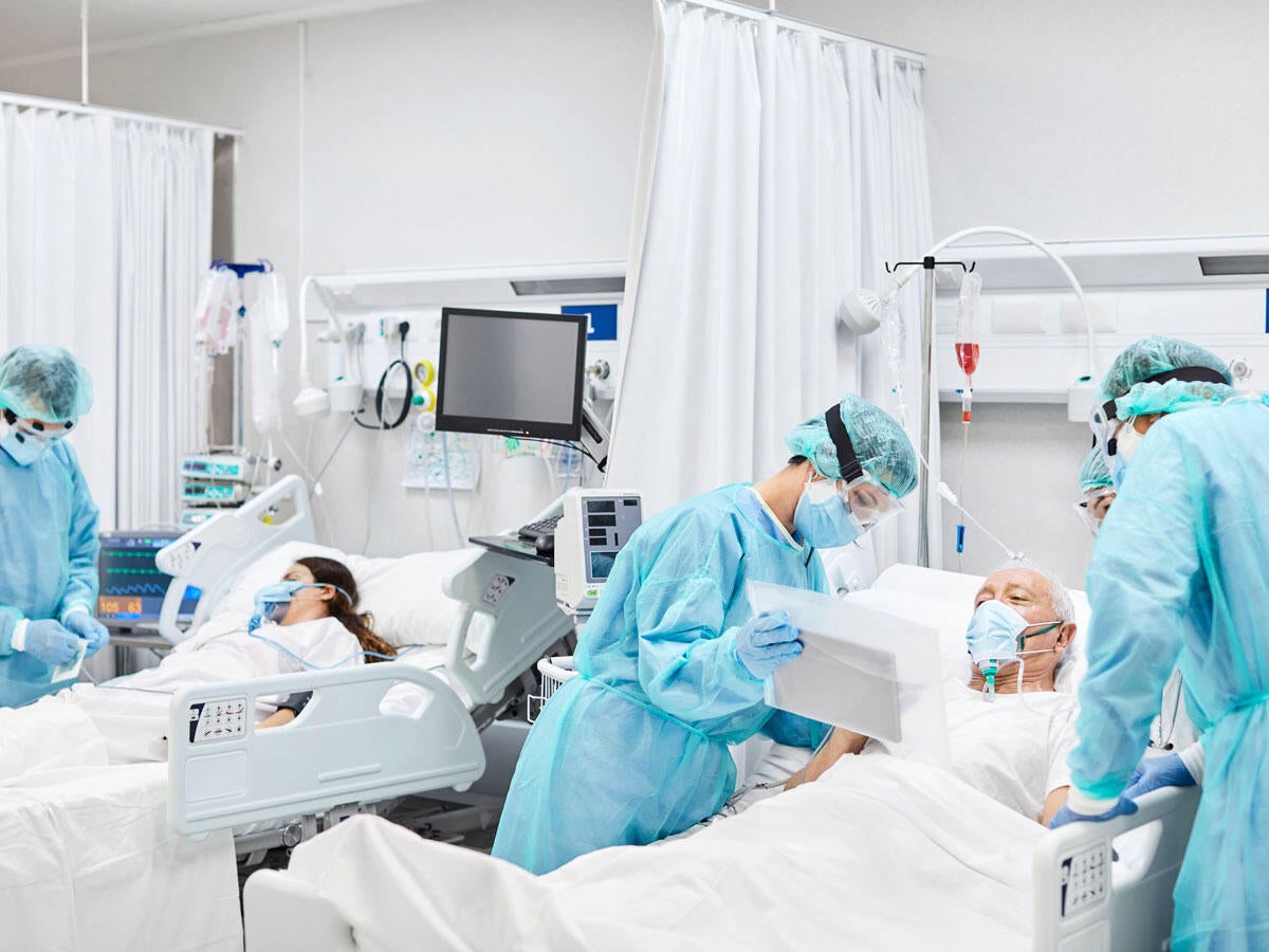 People working in a hospital suite