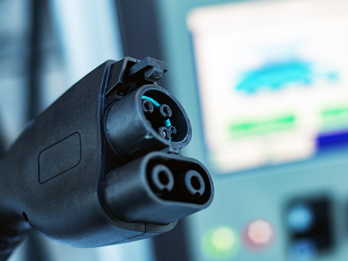 An electric vehicle charging station at a car dealership.