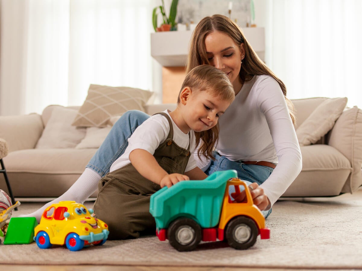 Mother and son playing with a toy