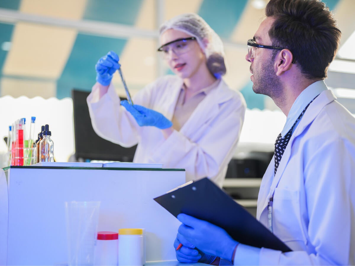 A man and a woman in a laboratory