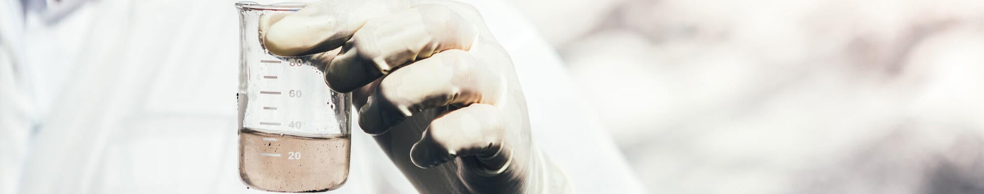 Close-up of person testing water sample.