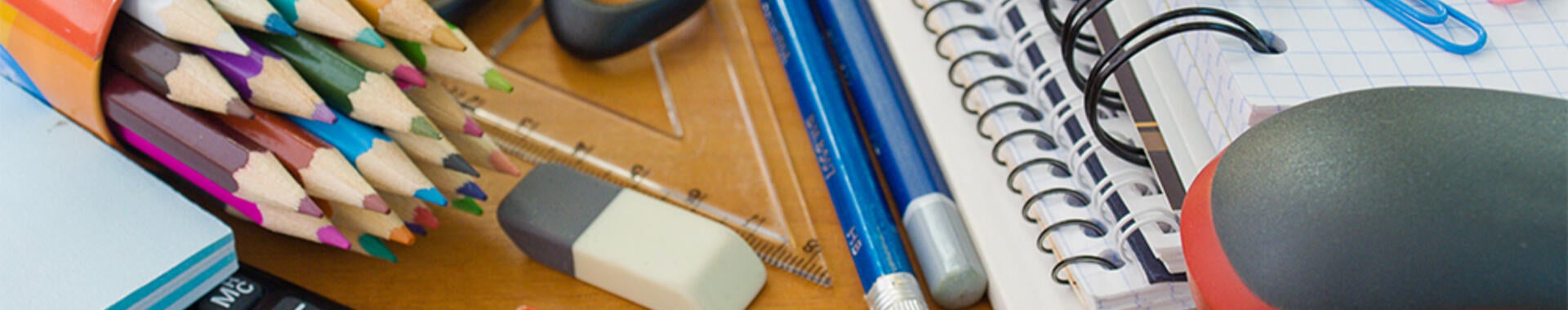 Assorted office supplies, notebooks, pencils