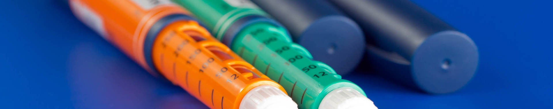 image of colorful syringes used for dispensing pharmaceuticals