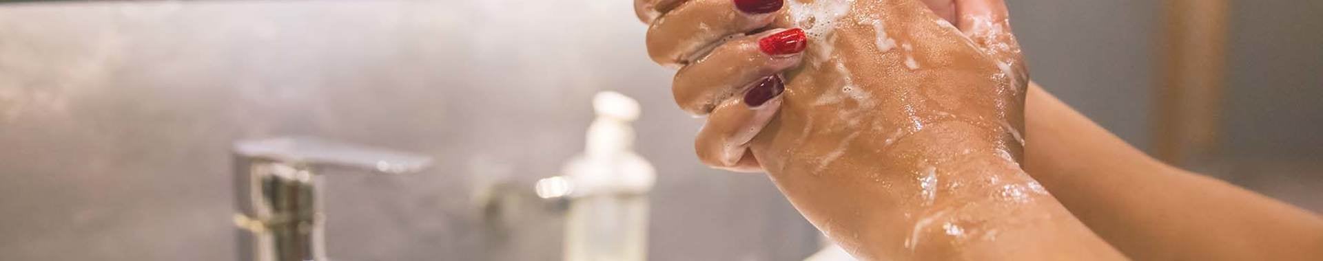 hands washing in a sink