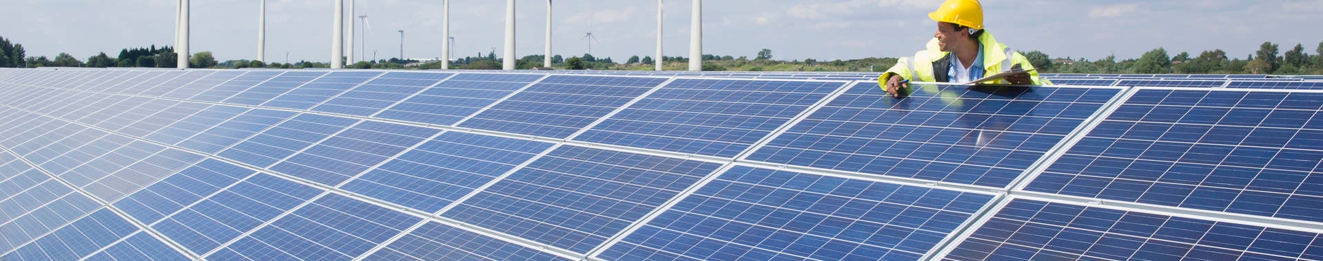 Man checking on solar panels