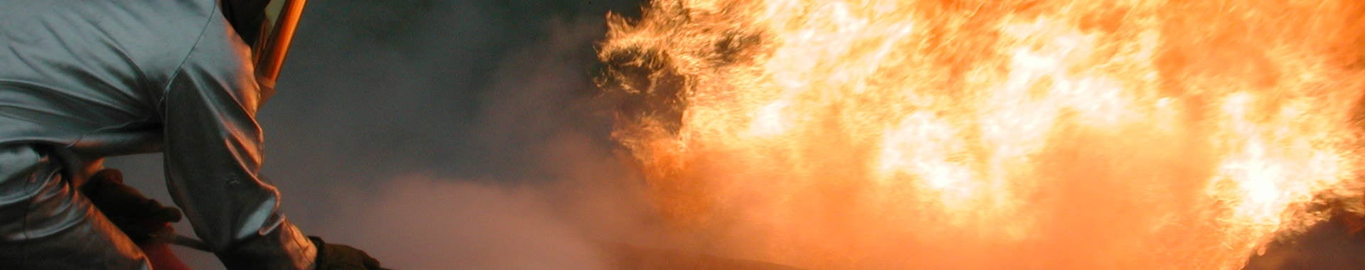 Firefighter fighting a practice fire