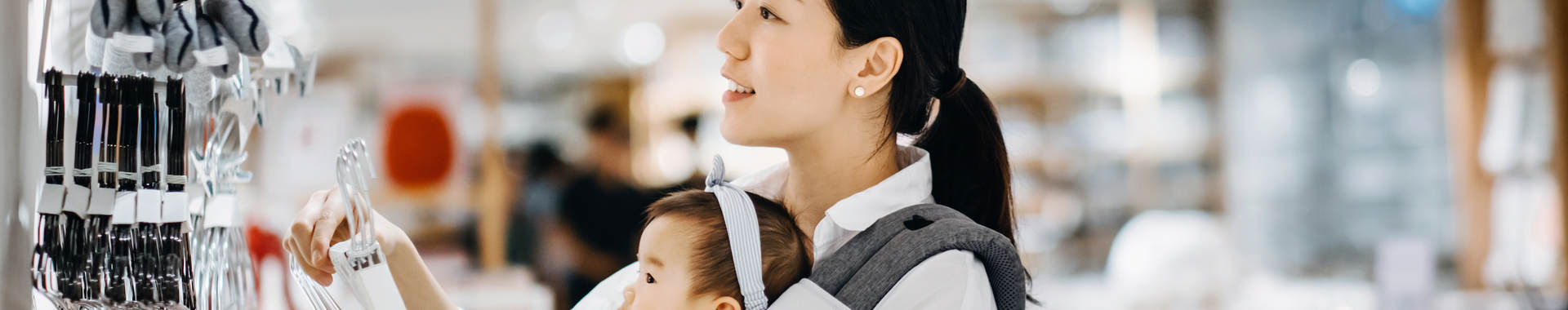 Asian women with baby shopping at department store
