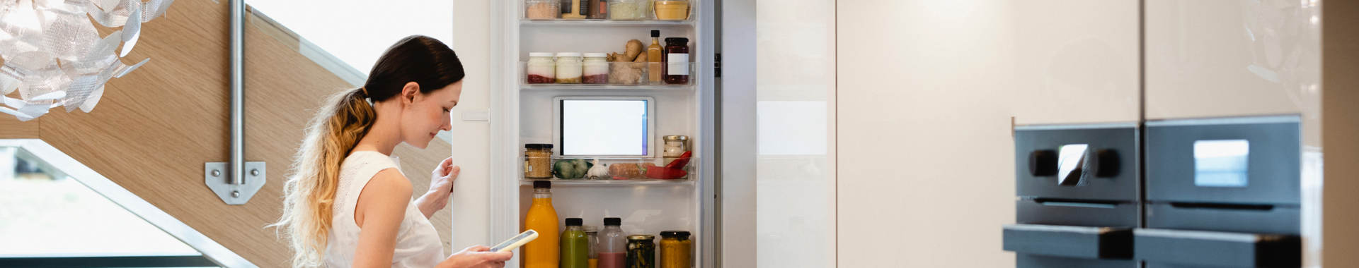 Woman looking into her fridge