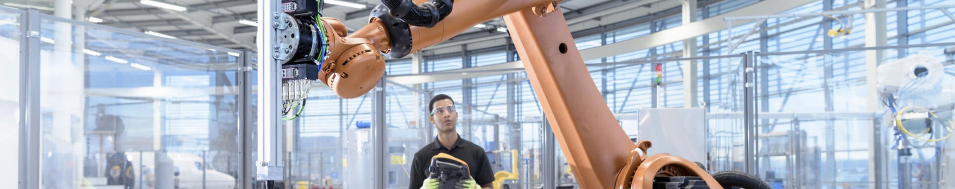 Operator directing robotic arm