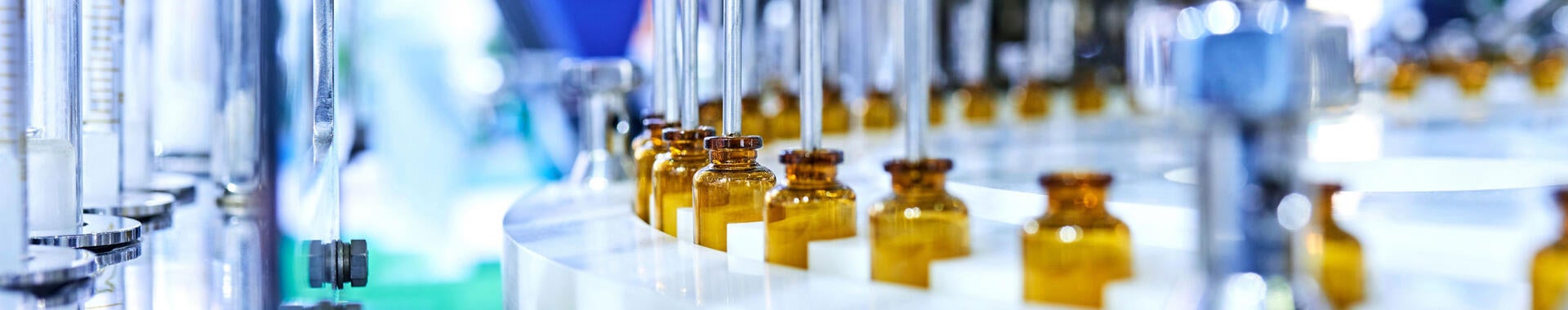 Glass medicine bottles on a factory line