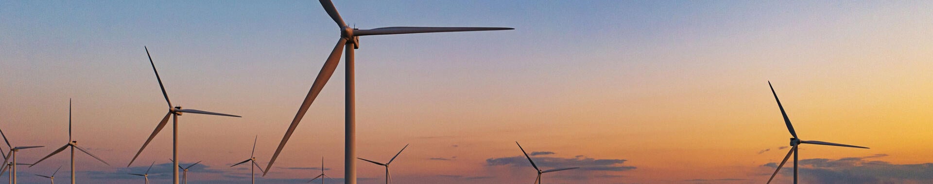 Drone view of a wind farm. Multiple wind turbines