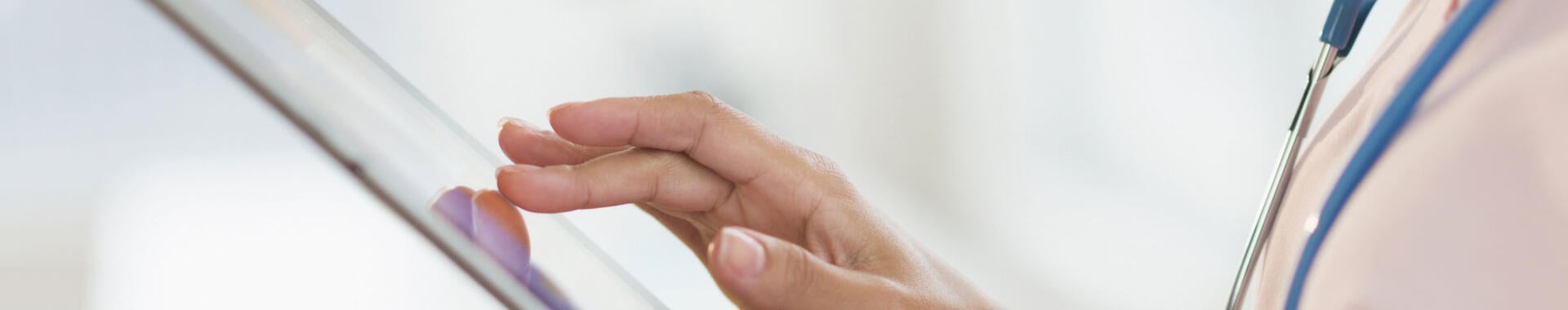 A doctor using a tablet
