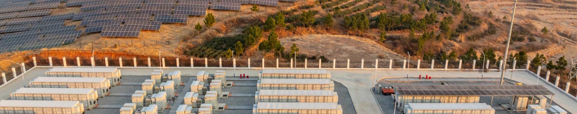 Overhead view of an energy power station next to a solar farm