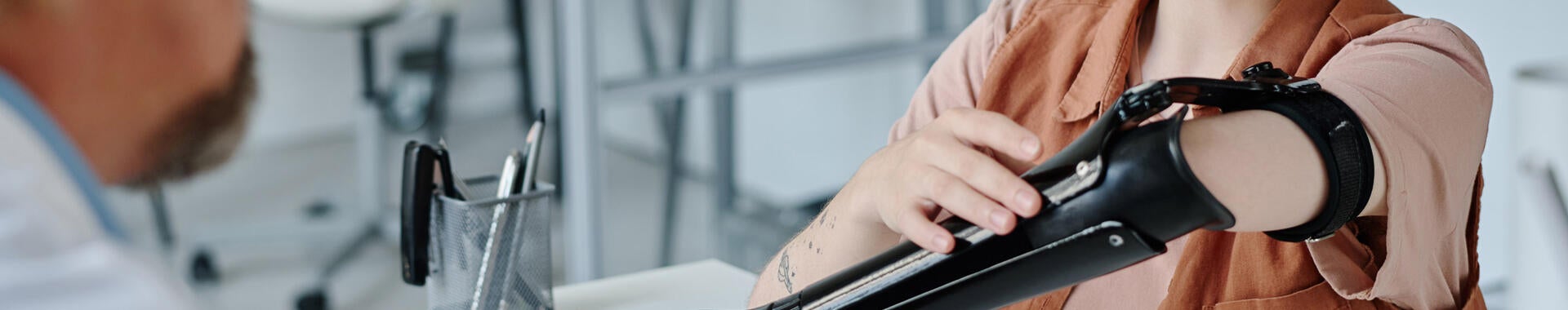 A patient discusses a prosthetic limb with the doctor