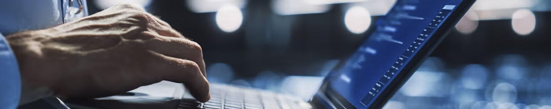 A person typing on a laptop