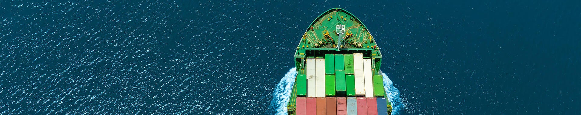 Shipping container sailing in the open sea