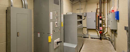 An electricalroom with circuit breakers.