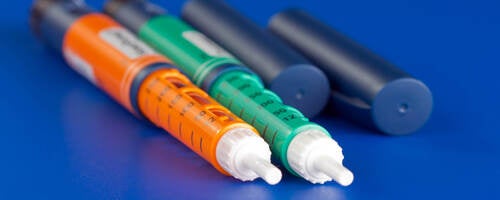 image of colorful syringes used for dispensing pharmaceuticals