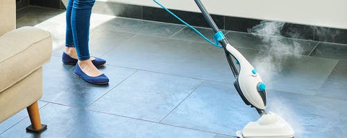 Steam cleaner mop cleaning a floor