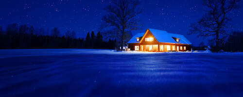 Residential home, lit up at night