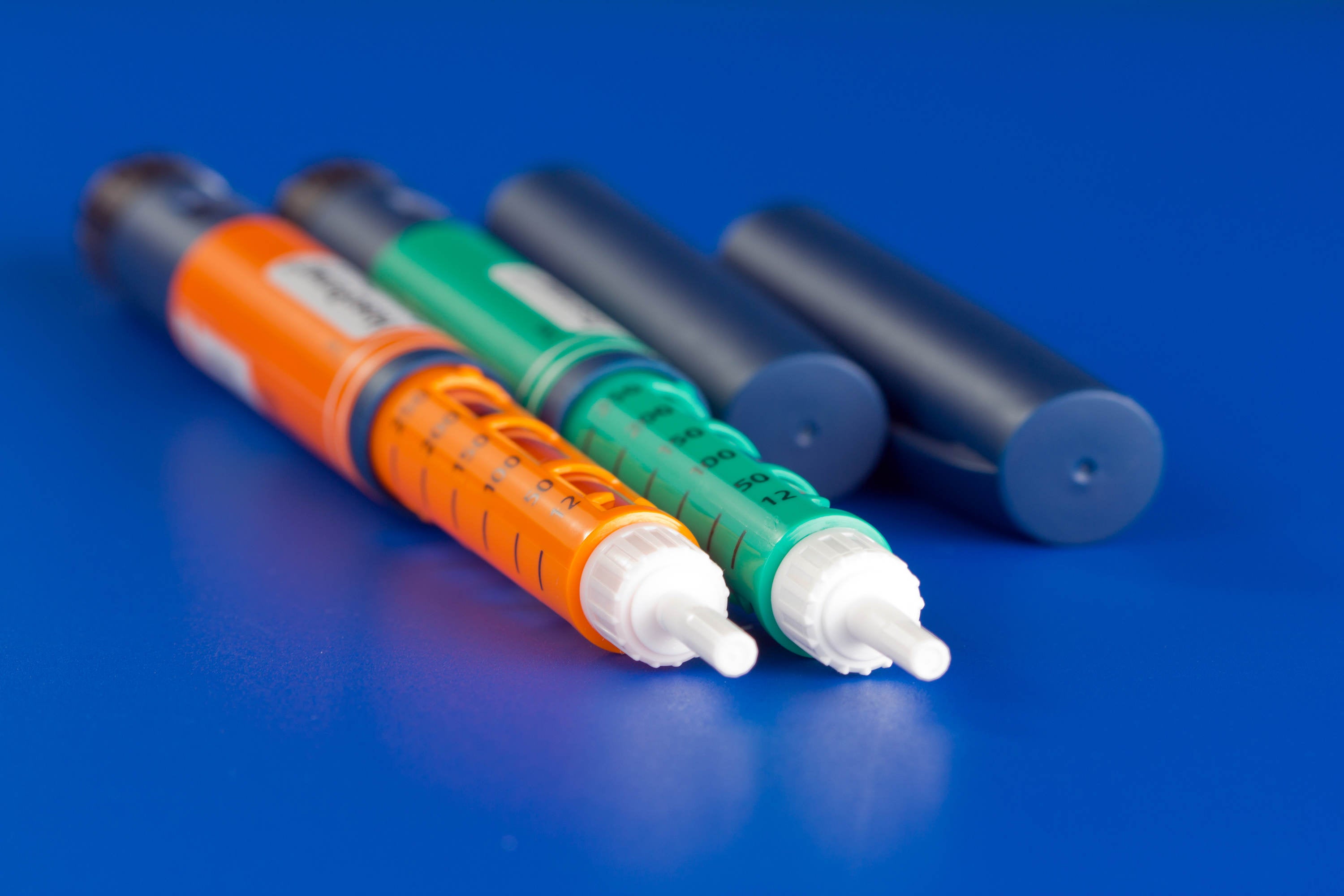 image of colorful syringes used for dispensing pharmaceuticals