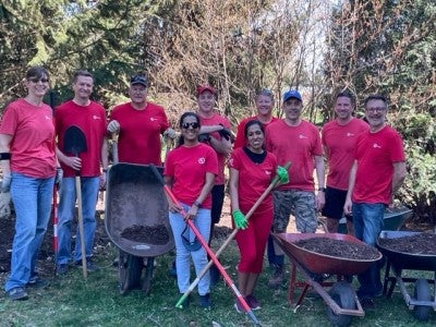 UL Solutions employees do landscaping at RMHC. 