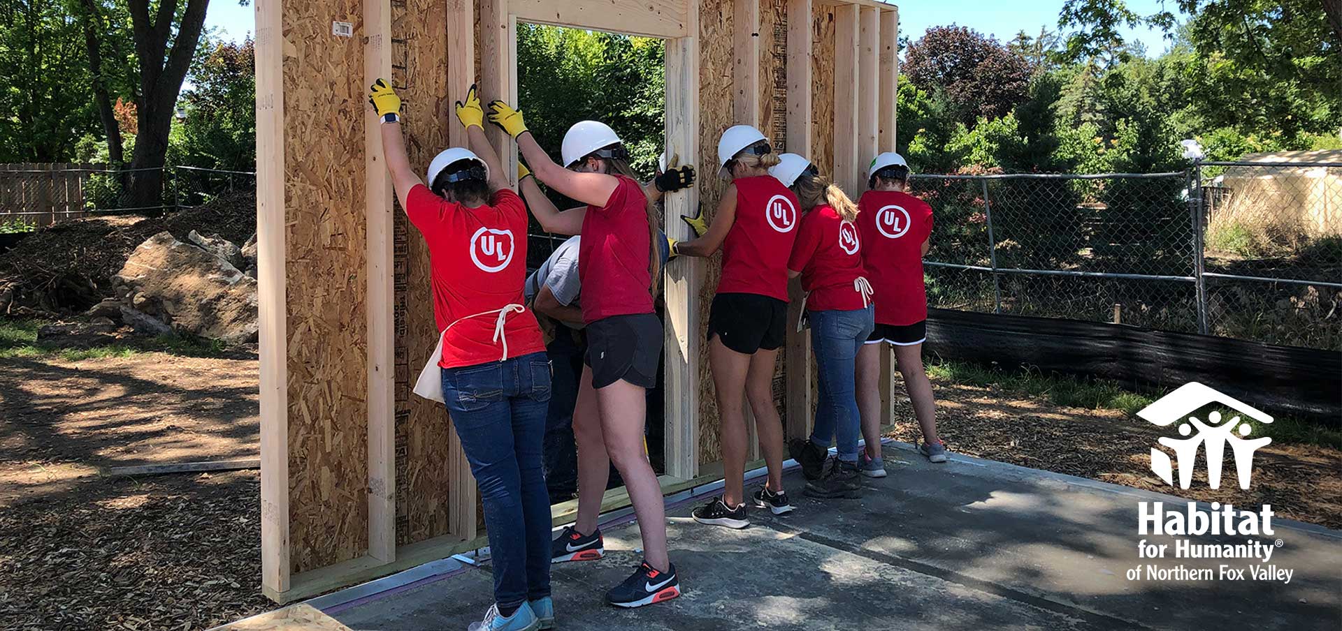UL employees putting up external wall for Habitat for Humanity